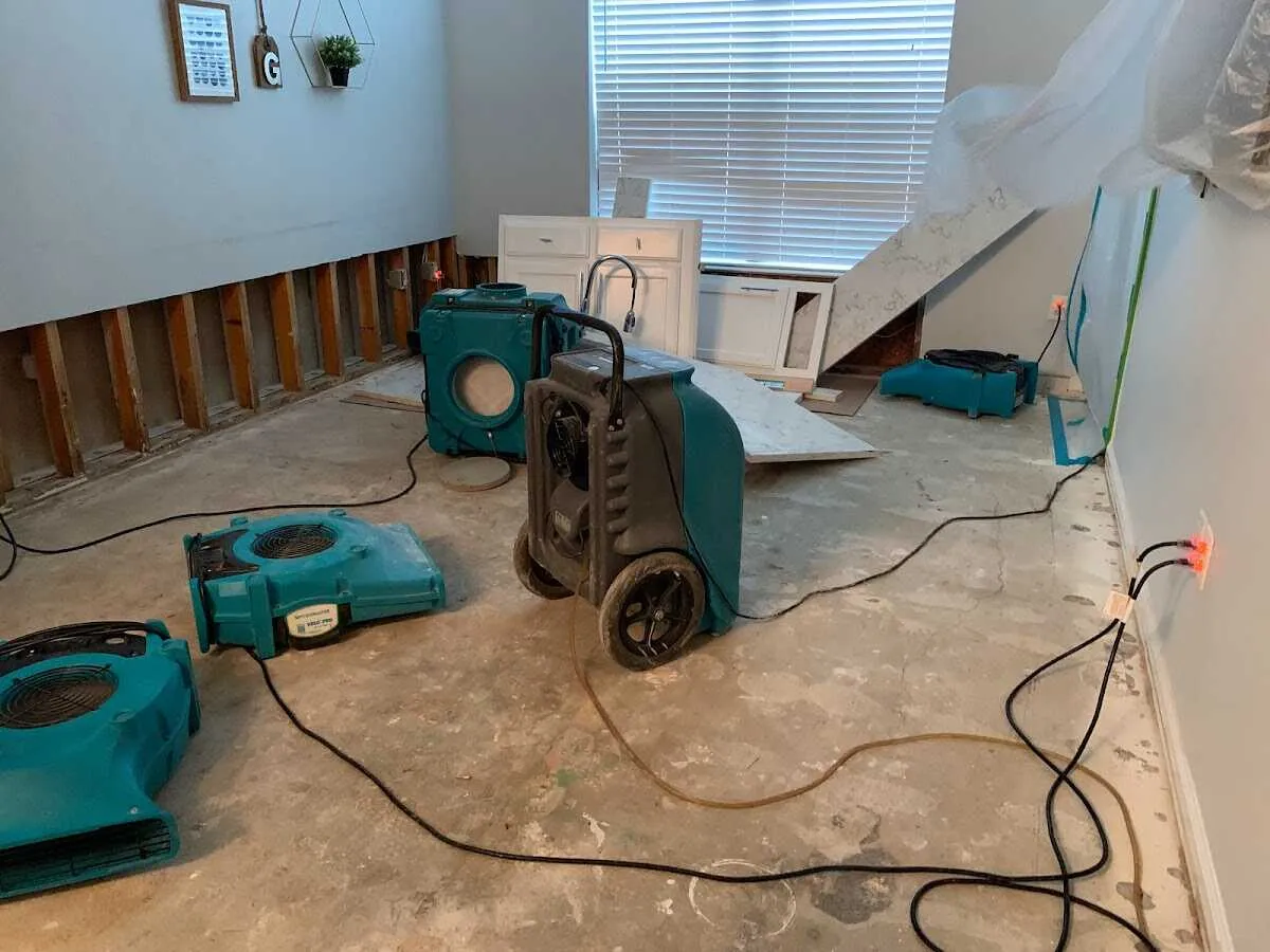Dehumidifier in flood-cut room for Water Damage Restoration in Angleton